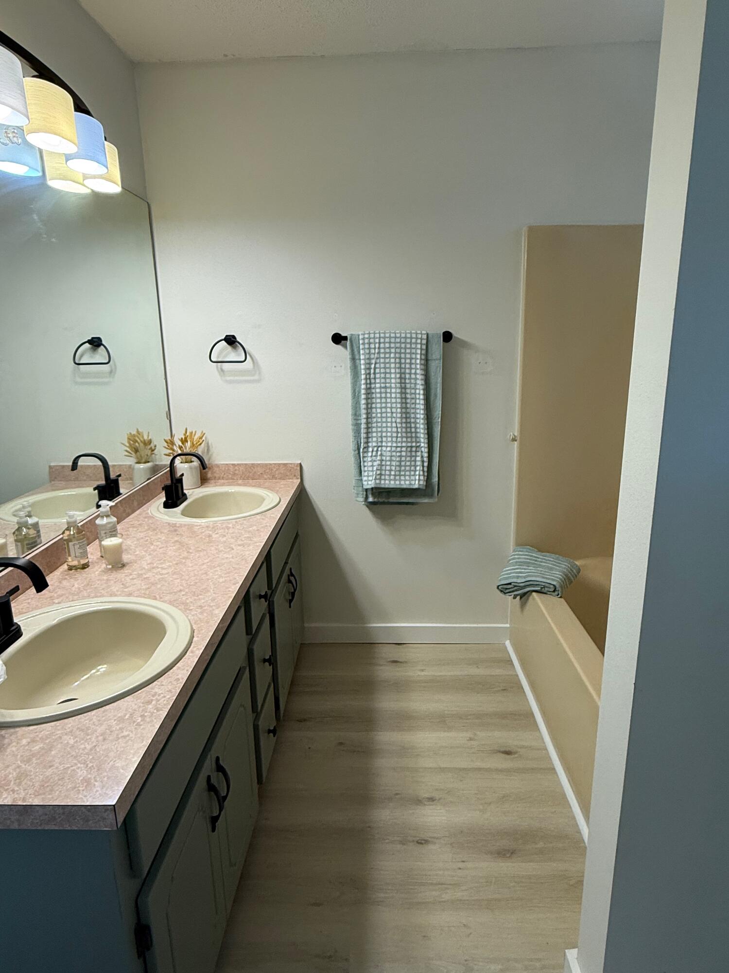 910 Elizabeth Lane Shalimar, FL 32579 - Photo 10 of 16 a bathroom with a sink and a mirror