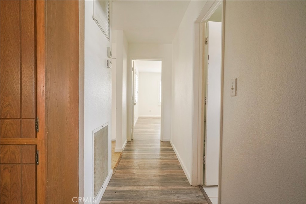 56320 Tamarisk Court Yucca Valley, CA 92284 - Photo 22 of 46 a view of a hallway with wooden floor