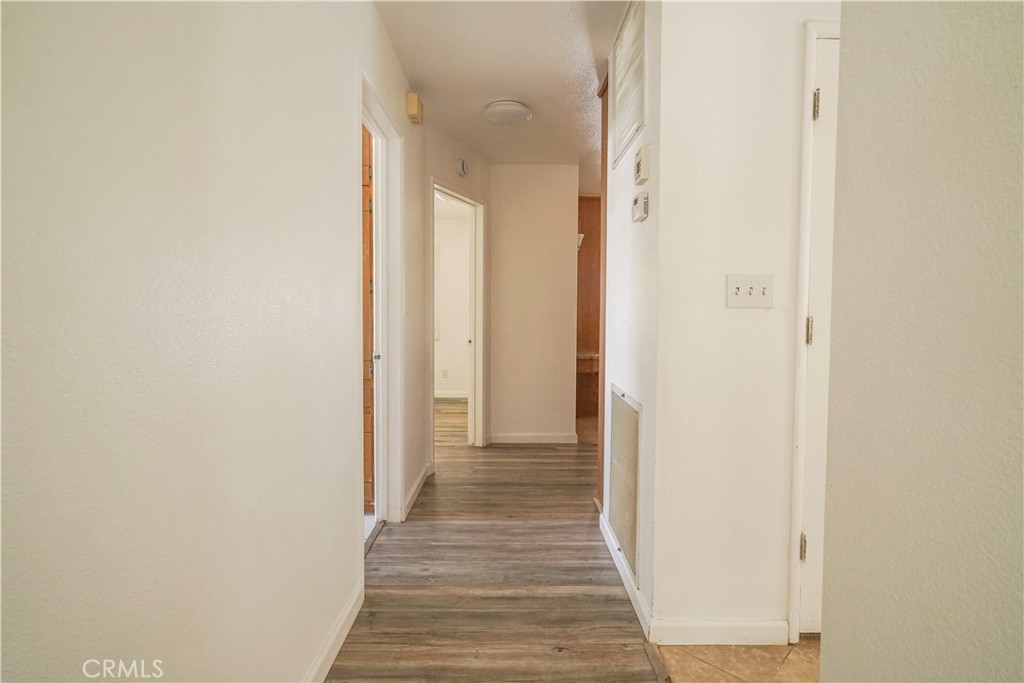 56320 Tamarisk Court Yucca Valley, CA 92284 - Photo 29 of 46 a view of a hallway with wooden floor