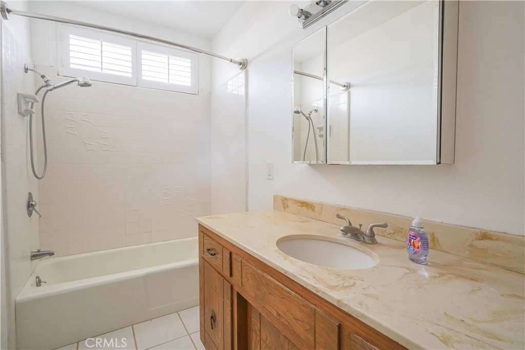 56320 Tamarisk Court Yucca Valley, CA 92284 - Photo 30 of 46 a bathroom with a granite countertop sink toilet and shower