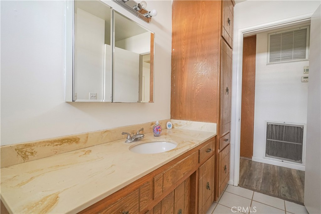 56320 Tamarisk Court Yucca Valley, CA 92284 - Photo 31 of 46 a bathroom with a sink and a mirror