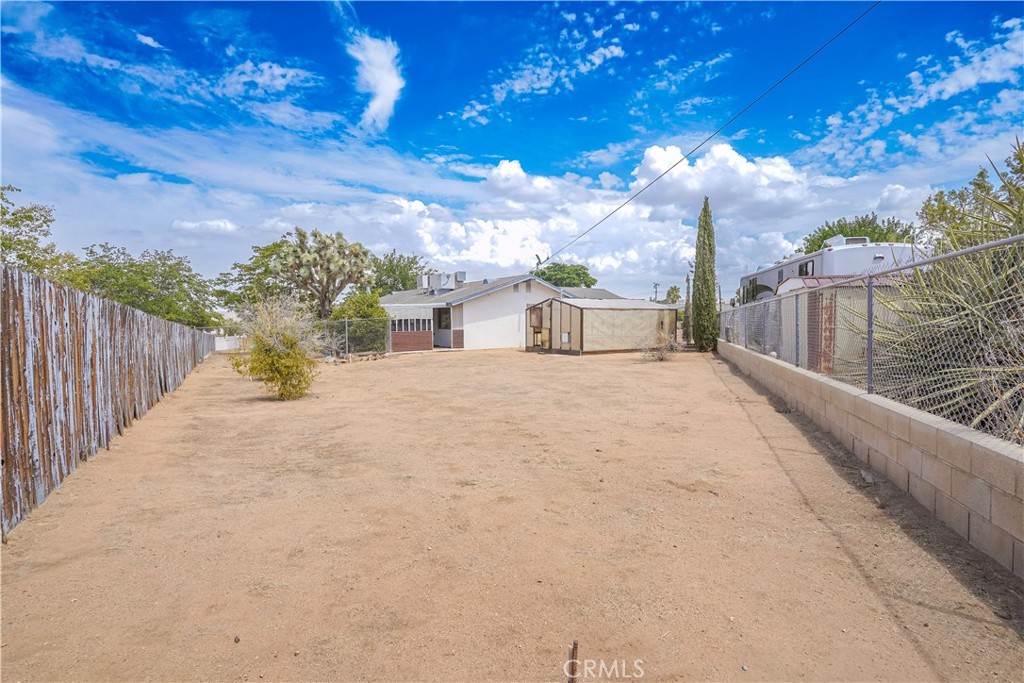 56320 Tamarisk Court Yucca Valley, CA 92284 - Photo 36 of 46 a view of a house with a yard