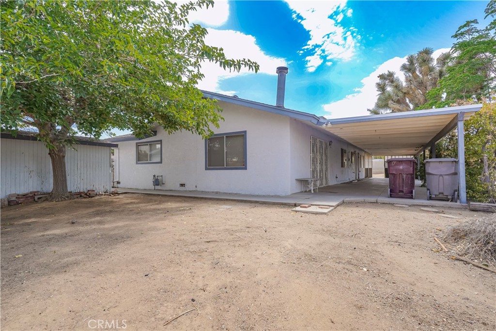 56320 Tamarisk Court Yucca Valley, CA 92284 - Photo 37 of 46 a view of a house with a garage and a garage