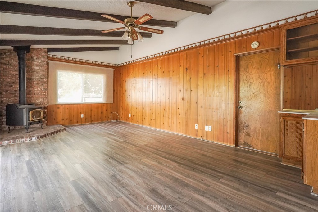 56320 Tamarisk Court Yucca Valley, CA 92284 - Photo 5 of 46 a view of empty room with wooden floor and fan