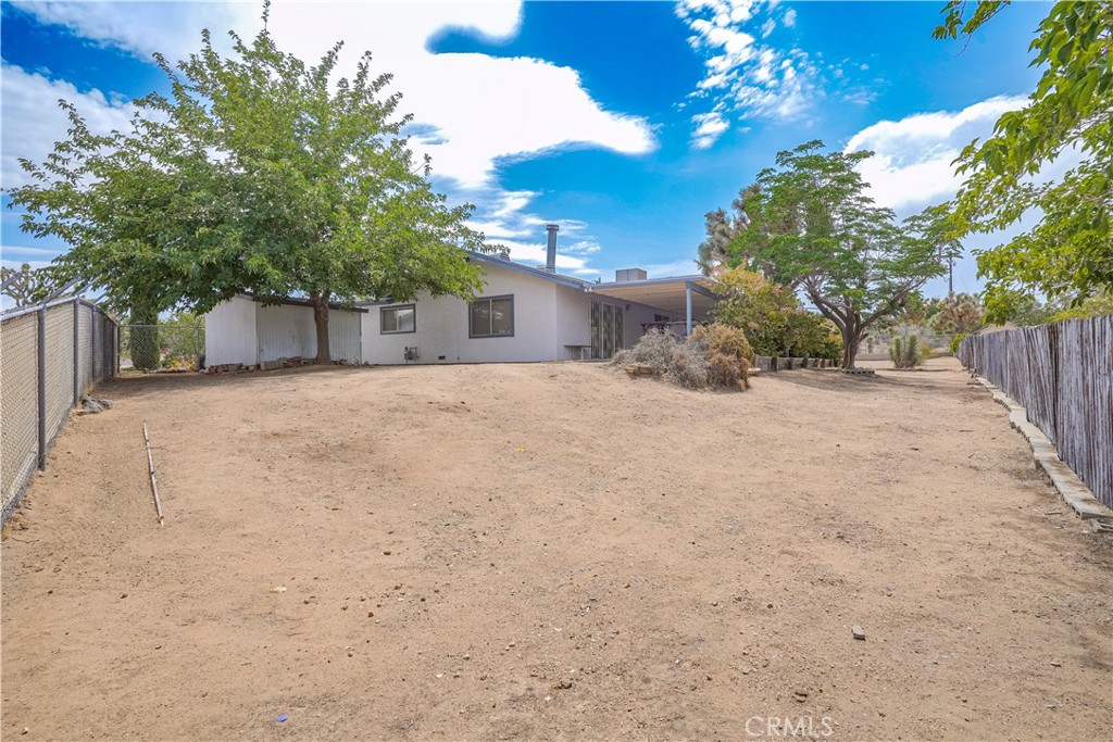 56320 Tamarisk Court Yucca Valley, CA 92284 - Photo 8 of 46 a view of a house with a snow in the yard