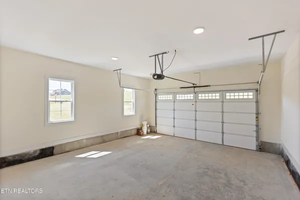 a view of a house with a wooden deck