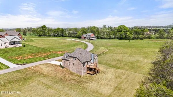 an aerial view of a house with outdoor space