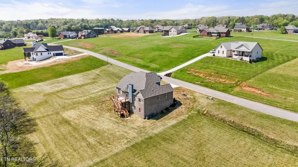 a aerial view of a house with a yard