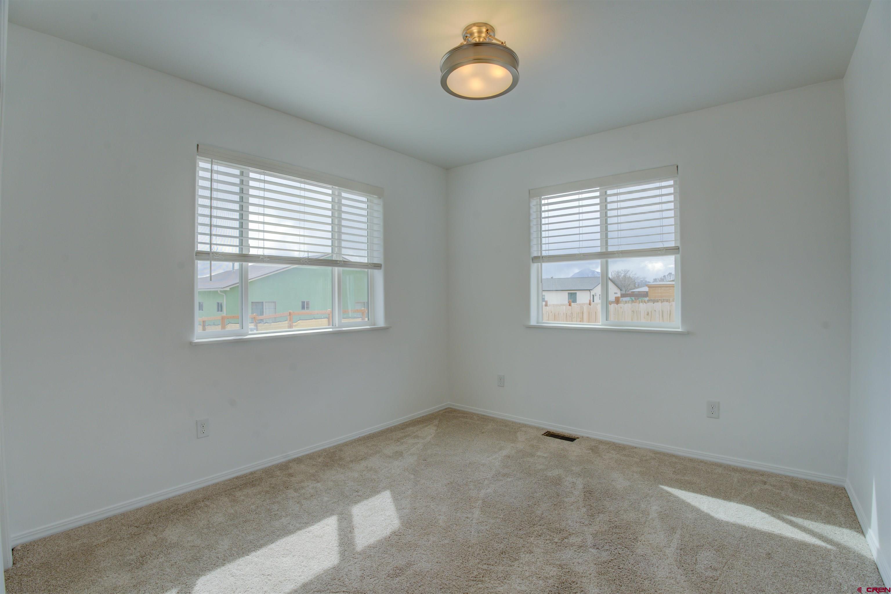 431 Juniper Place Cortez, CO 81321 - Photo 15 of 36 an empty room with a window