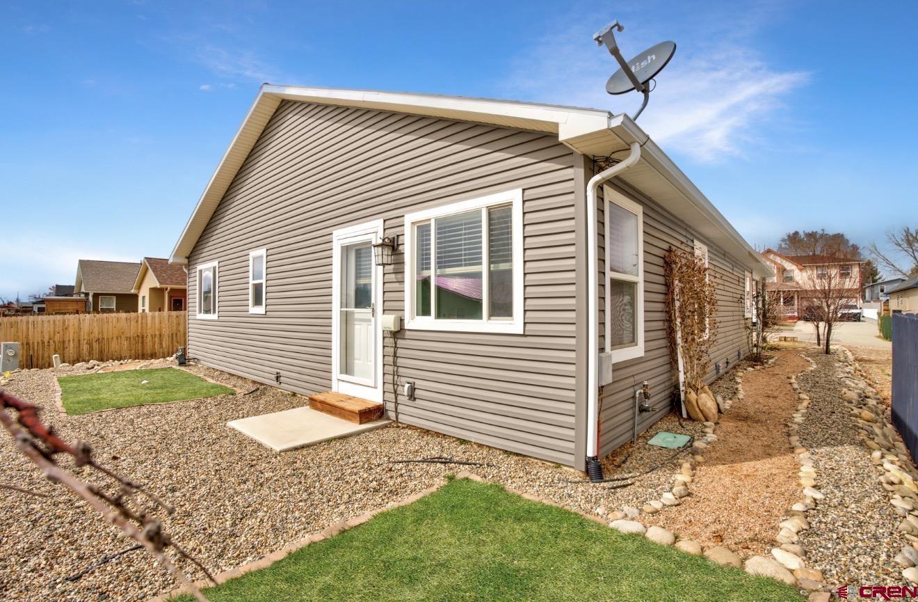 431 Juniper Place Cortez, CO 81321 - Photo 29 of 36 a view of a house with a yard