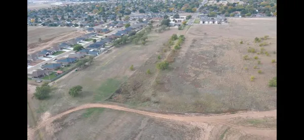 a view of a dry yard with wooden floor