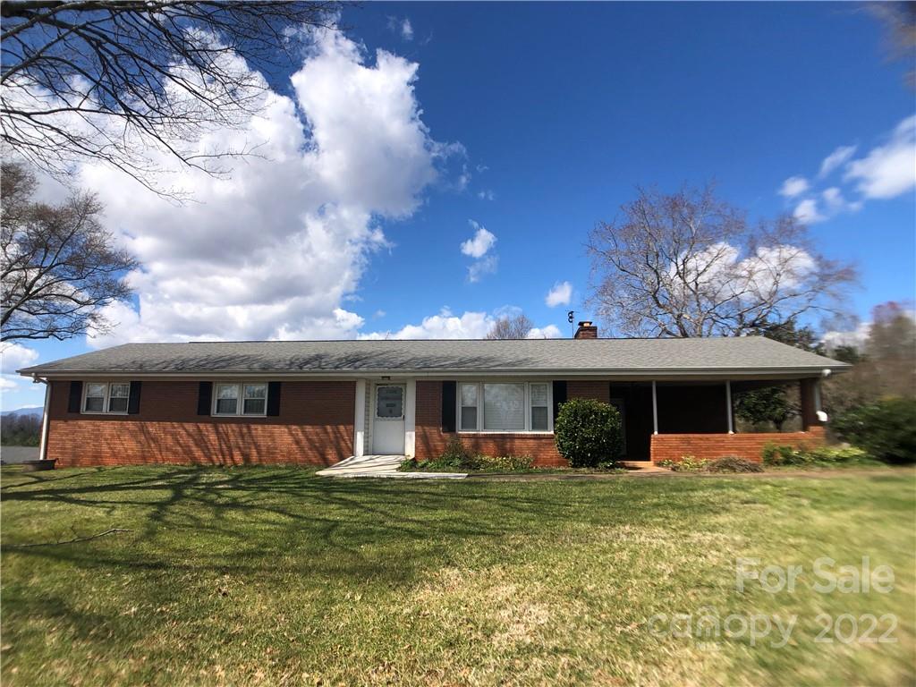 178 Skyview Ridge Rutherfordton, NC 28139 - Photo 1 of 43 a view of a house with a backyard porch and furniture
