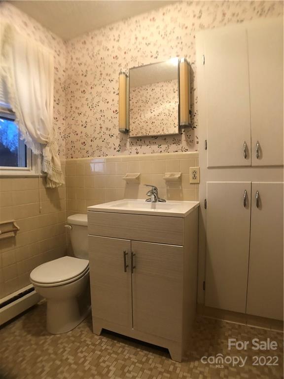 178 Skyview Ridge Rutherfordton, NC 28139 - Photo 19 of 43 a bathroom with a sink toilet and mirror