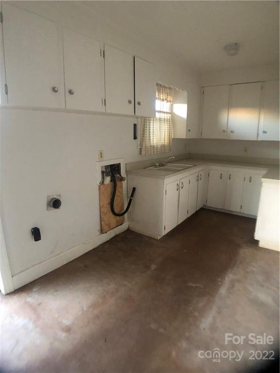178 Skyview Ridge Rutherfordton, NC 28139 - Photo 21 of 43 a kitchen with white cabinets and white appliances