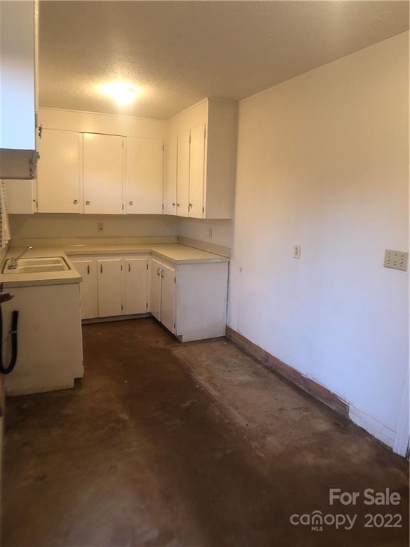 178 Skyview Ridge Rutherfordton, NC 28139 - Photo 22 of 43 a room with a sink cabinets and utility room