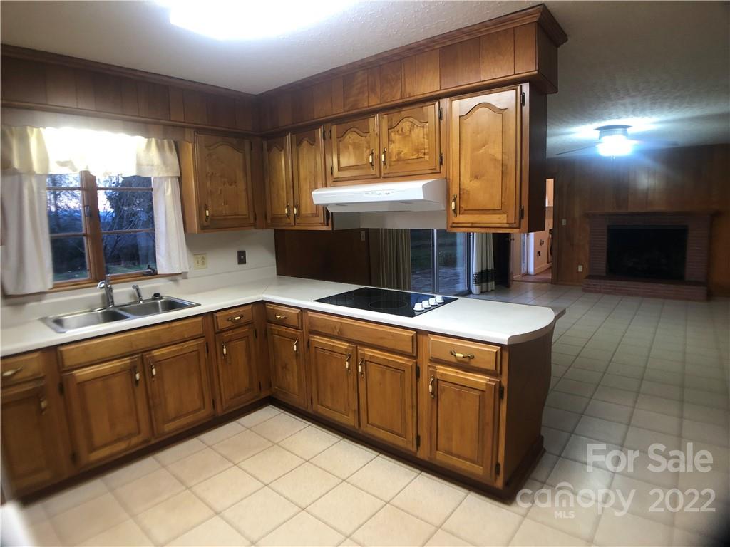 178 Skyview Ridge Rutherfordton, NC 28139 - Photo 25 of 43 a kitchen with stainless steel appliances granite countertop a sink and a stove