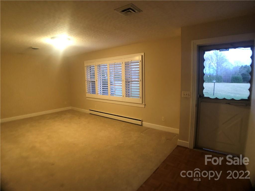 178 Skyview Ridge Rutherfordton, NC 28139 - Photo 10 of 43 an empty room with windows