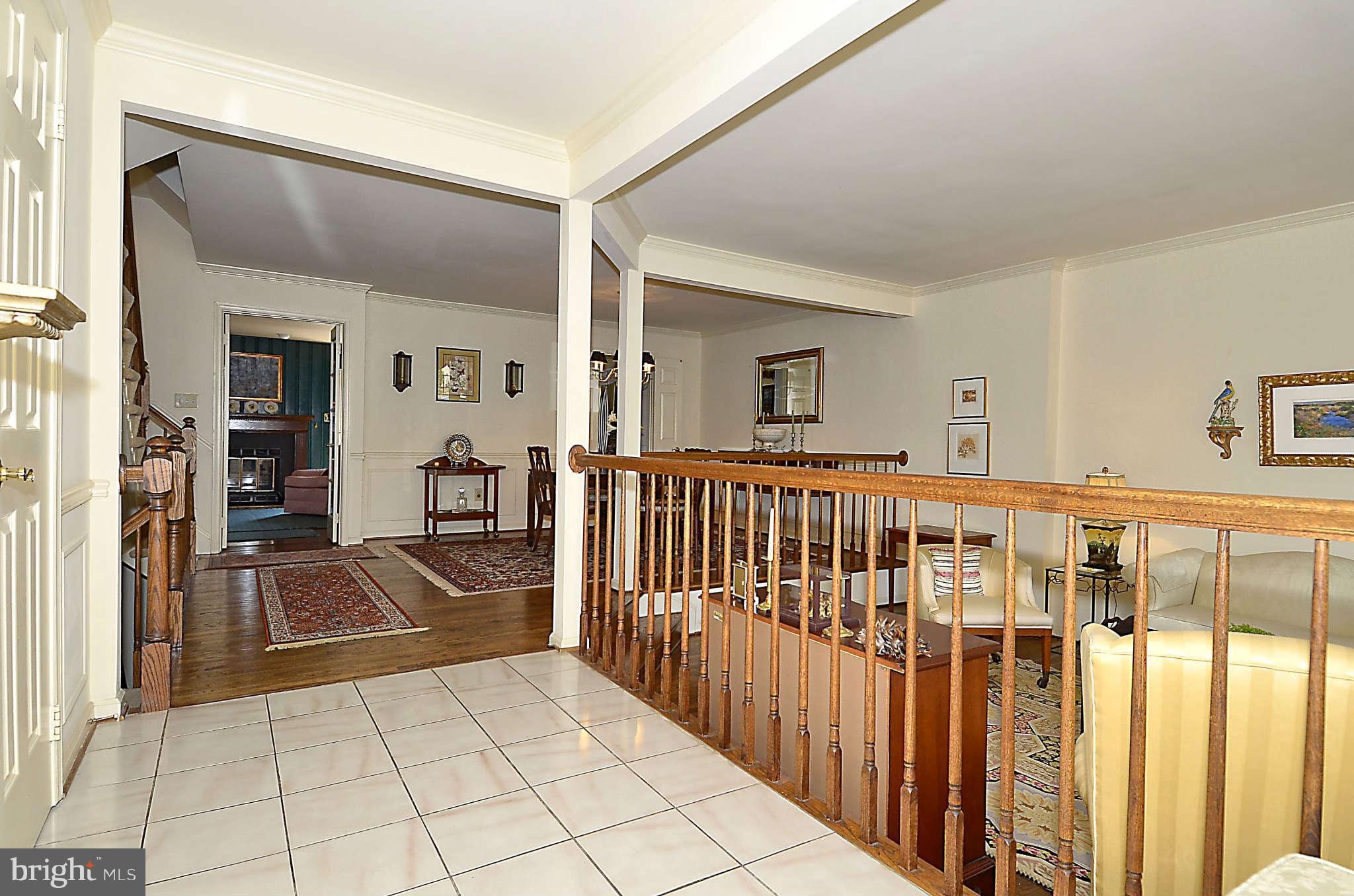 10708 Brewer House Road North Bethesda, MD 20852 - Photo 2 of 26 a view of a livingroom with a dinning table and staircase