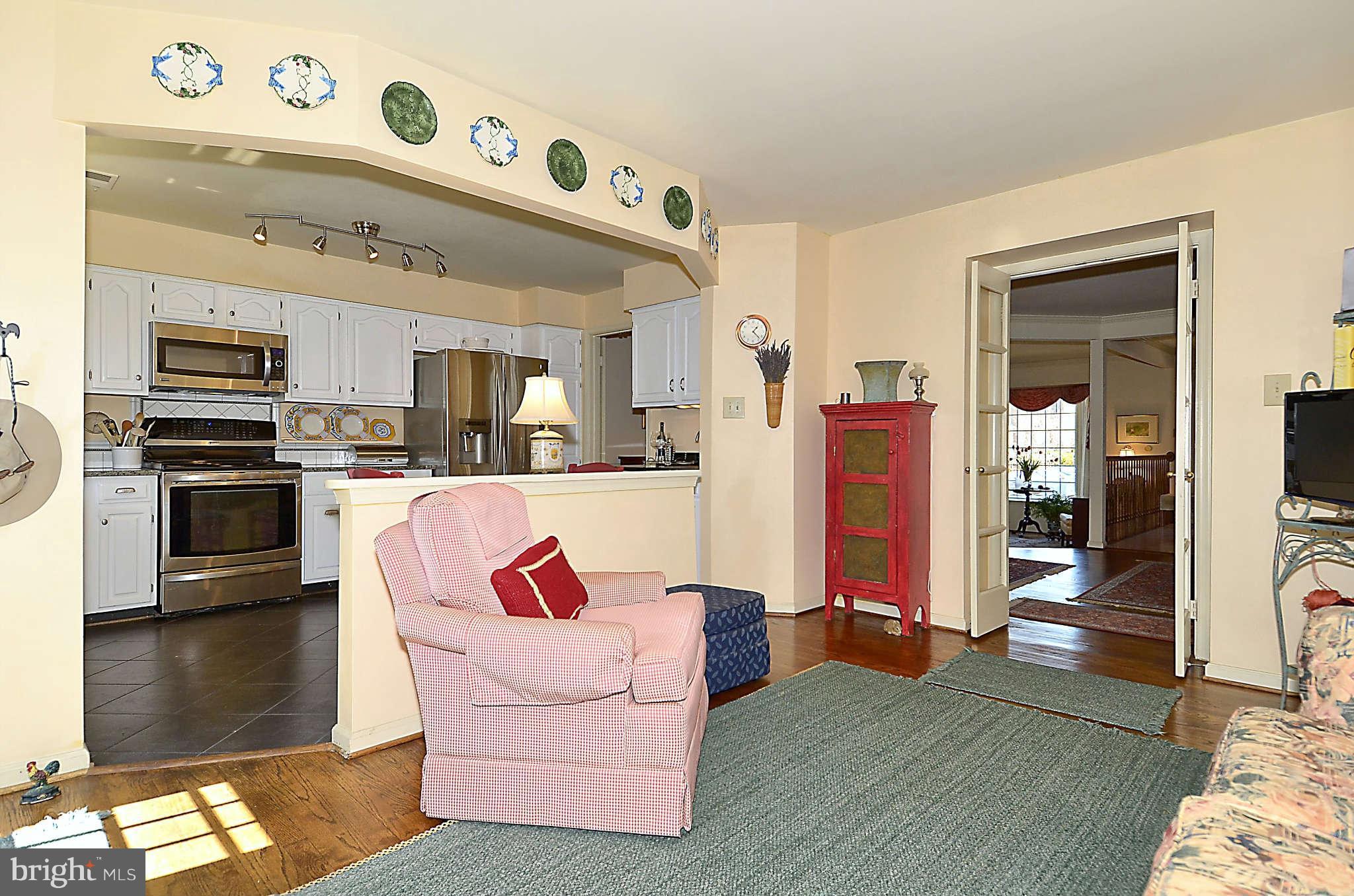 10708 Brewer House Road North Bethesda, MD 20852 - Photo 11 of 26 a living room with furniture and a kitchen