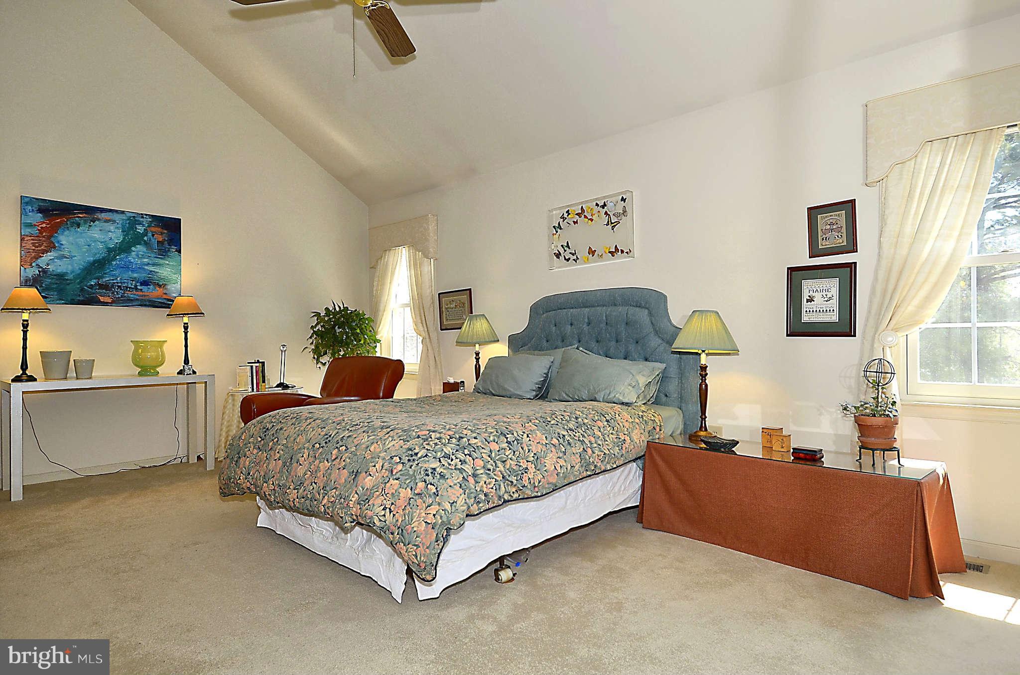 10708 Brewer House Road North Bethesda, MD 20852 - Photo 15 of 26 a bedroom with a bed and a couch