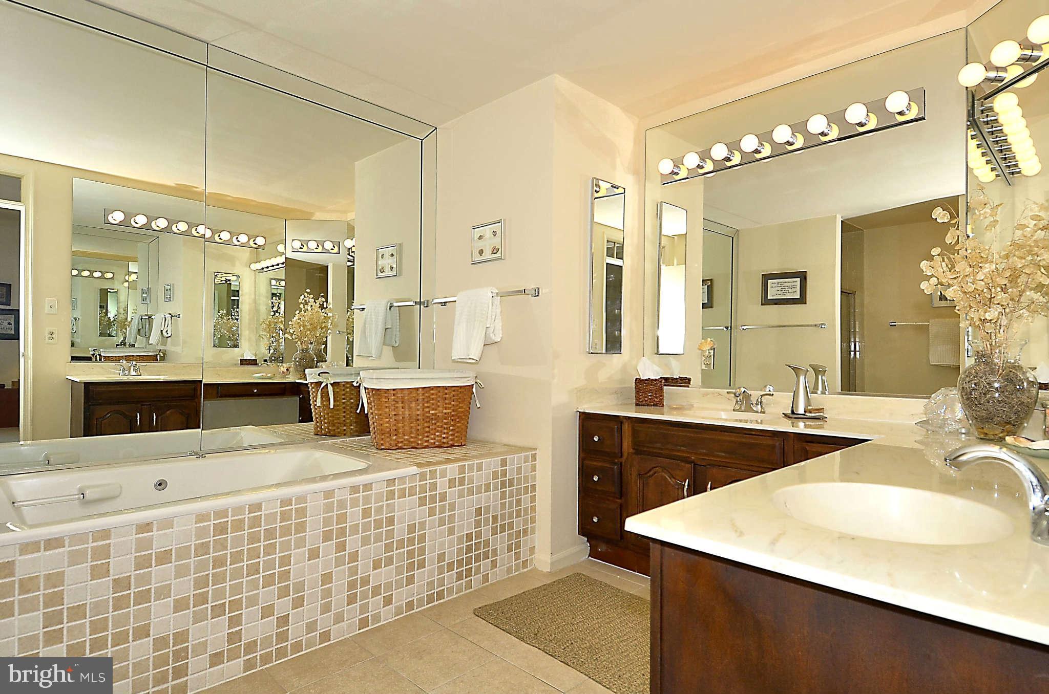 10708 Brewer House Road North Bethesda, MD 20852 - Photo 19 of 26 a bathroom with a double vanity sink mirror and