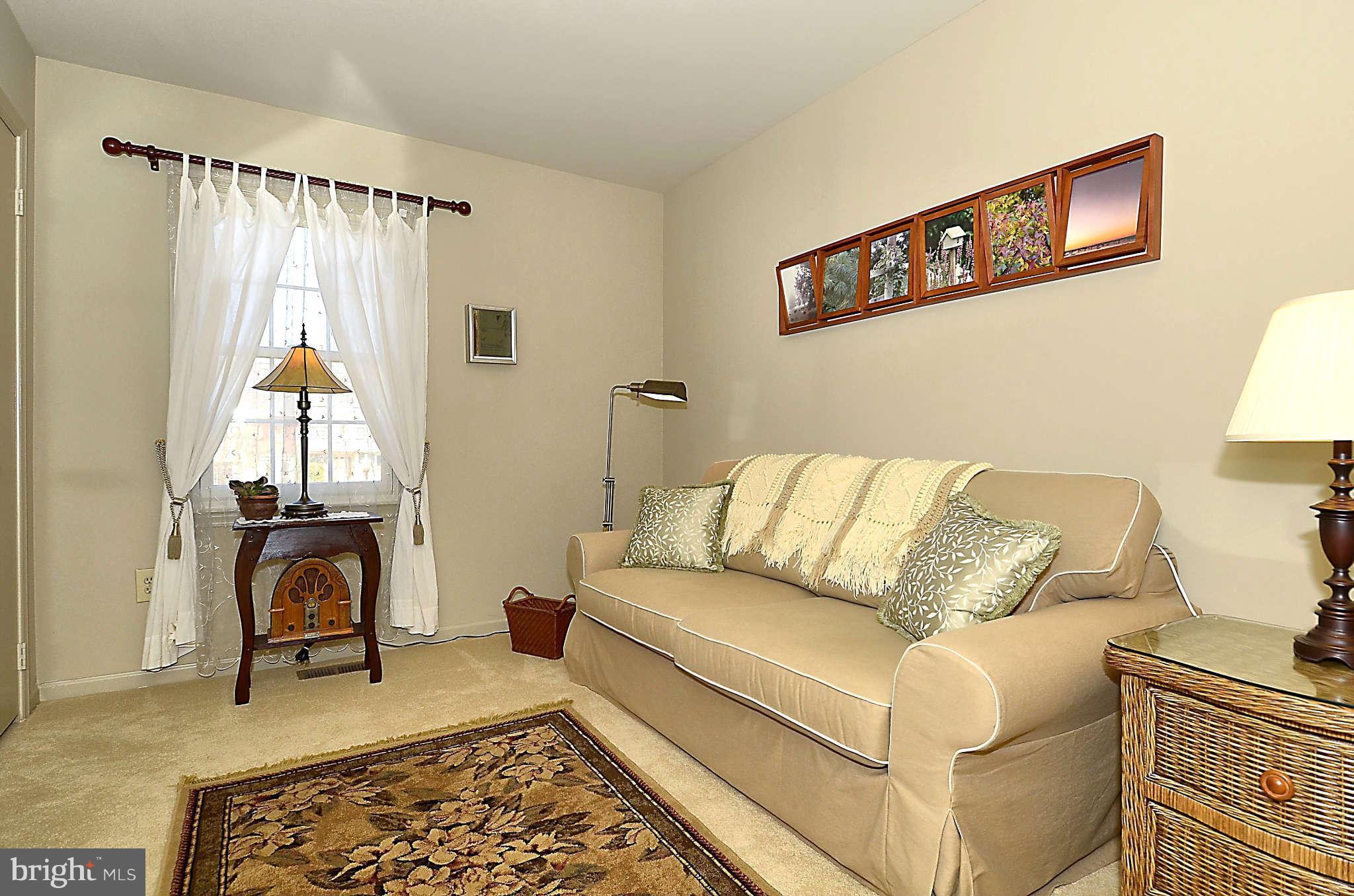 10708 Brewer House Road North Bethesda, MD 20852 - Photo 22 of 26 a living room with furniture and a rug