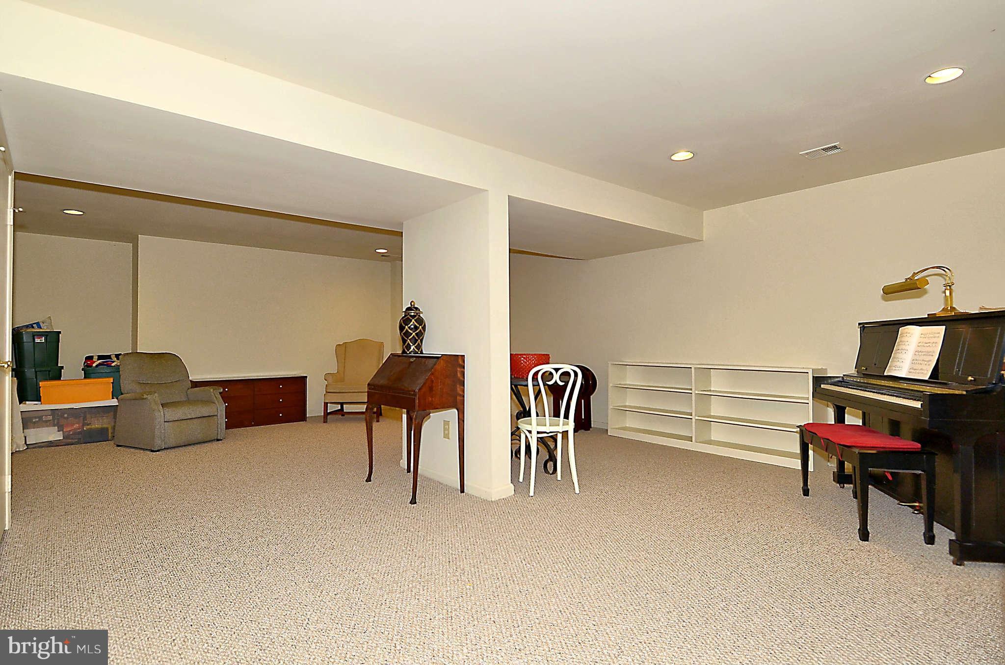 10708 Brewer House Road North Bethesda, MD 20852 - Photo 23 of 26 a living room with furniture and a chair
