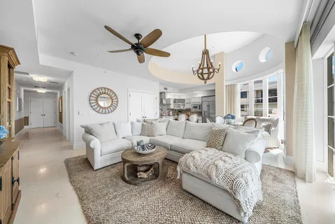 a kitchen with stainless steel appliances granite countertop a refrigerator sink and stove