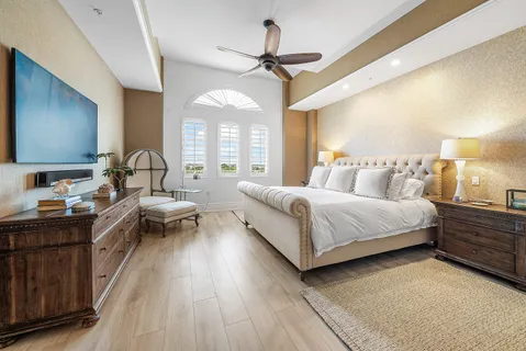 a large white kitchen with a large window