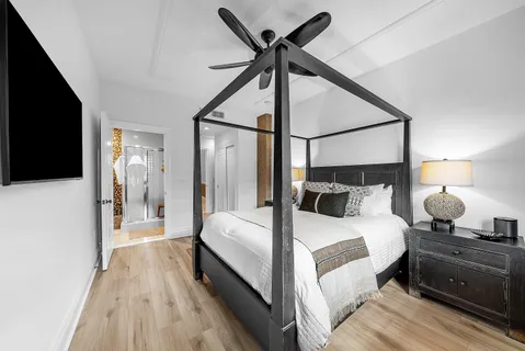 a view of a livingroom with furniture and a flat screen tv