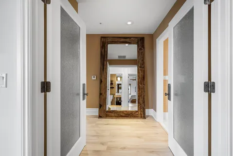 a view of house with swimming pool and sitting area