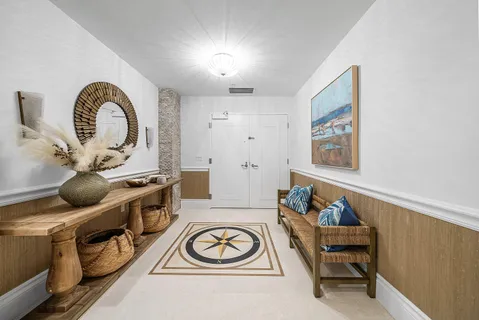 a view of a patio with couches table and chairs potted plants and palm tree