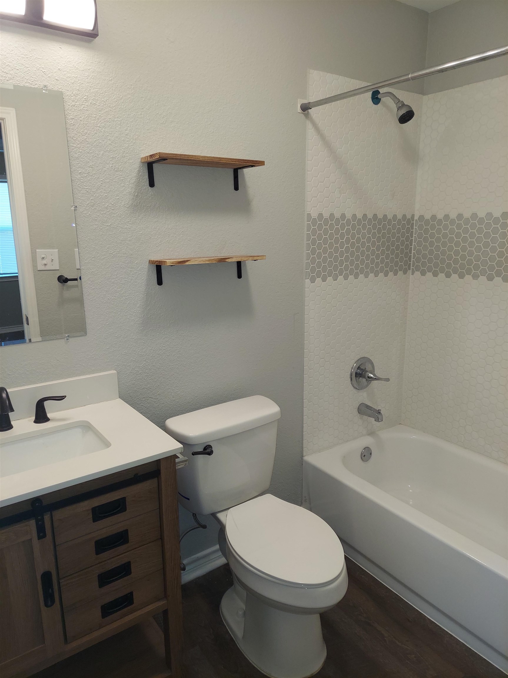 606 South Pierce Street Burnet, TX 78611 - Photo 6 of 9 a bathroom with a sink toilet and shower