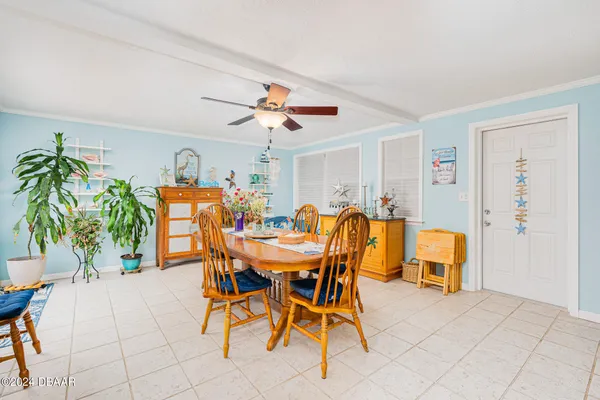 a view of a dining room with furniture and a livingroom