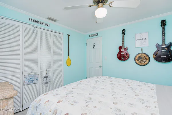 a bedroom with a bed and a dresser in it