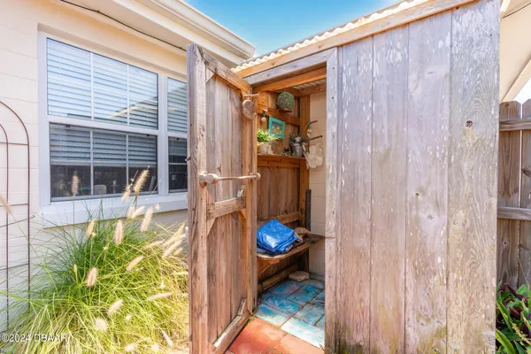 a view of a house with backyard porch and patio