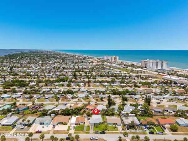 an aerial view of residential building and ocean