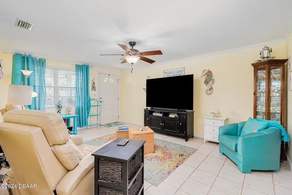 a living room with furniture and a flat screen tv