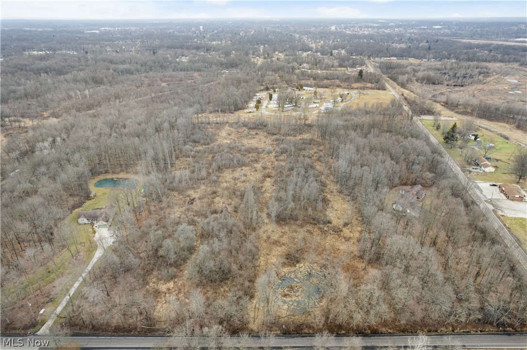 Lane Road Southwest Warren, OH 44481 - Photo 9 of 9 Aerial view of property's location with a nearby body of water and a heavily wooded area