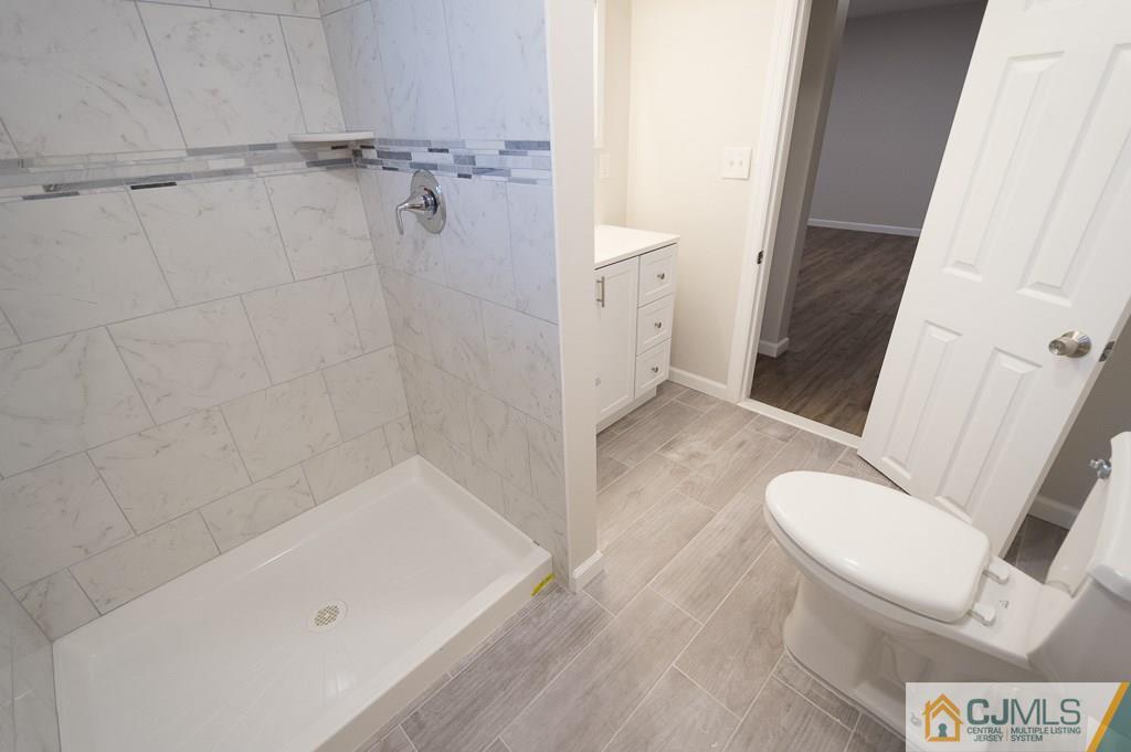 5 High Point Road East Brunswick, NJ 08816 - Photo 20 of 24 a bathroom with a sink and toilet