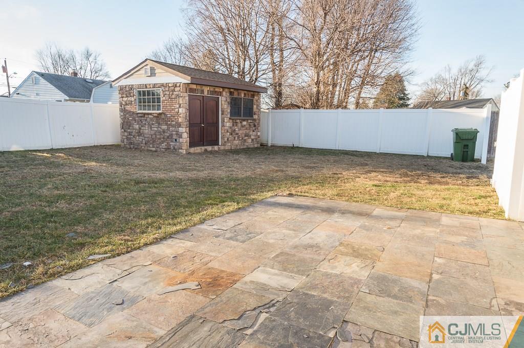 5 High Point Road East Brunswick, NJ 08816 - Photo 23 of 24 a front view of a house with a yard