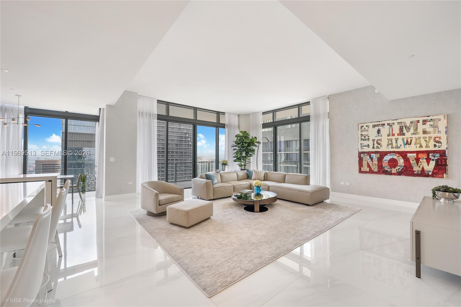 88 Southwest 7th Street, Unit 4101 Miami, FL 33130 - Photo 2 of 35 a living room with furniture and a large window