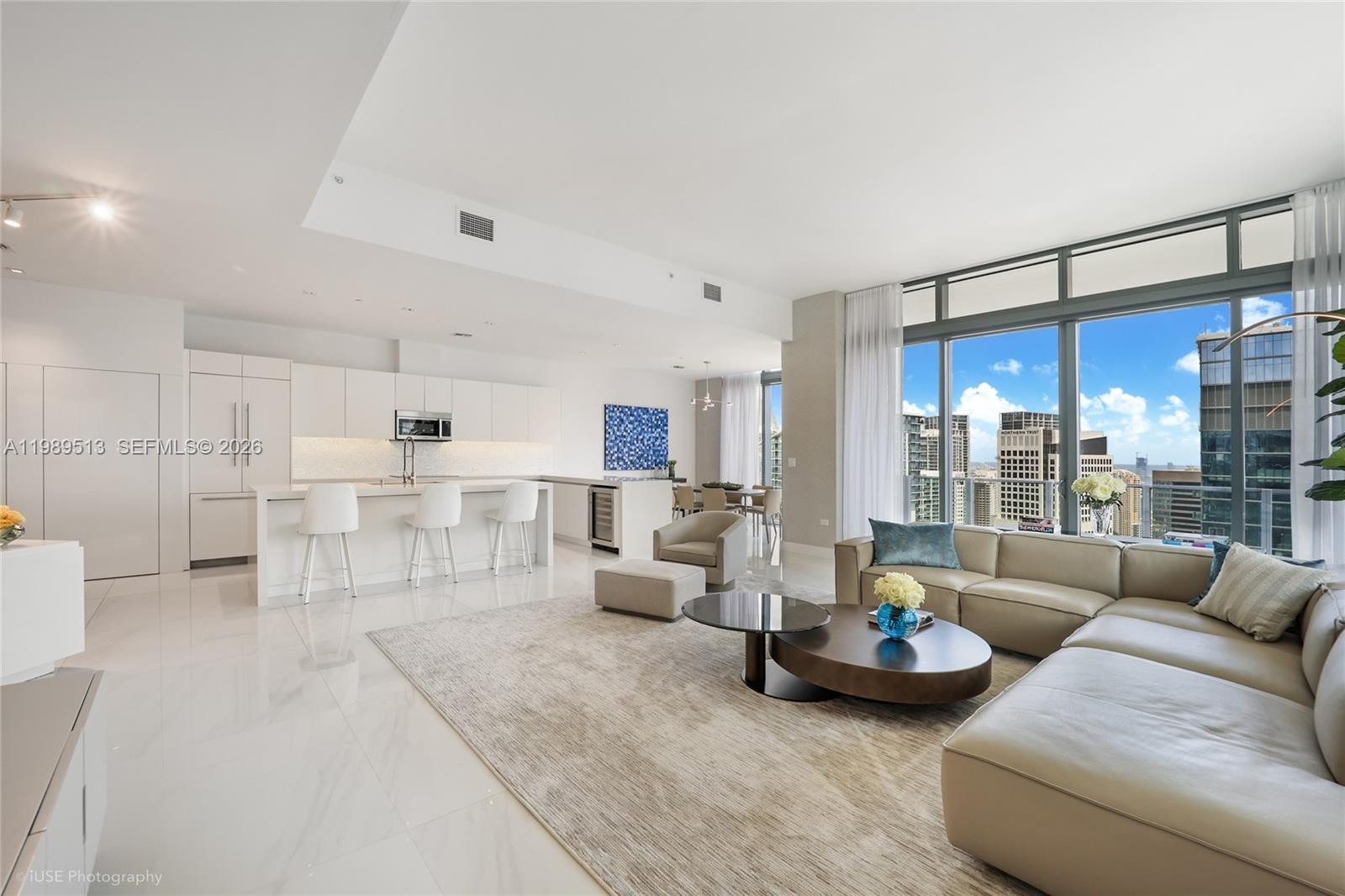 88 Southwest 7th Street, Unit 4101 Miami, FL 33130 - Photo 7 of 35 a living room with furniture and a large window