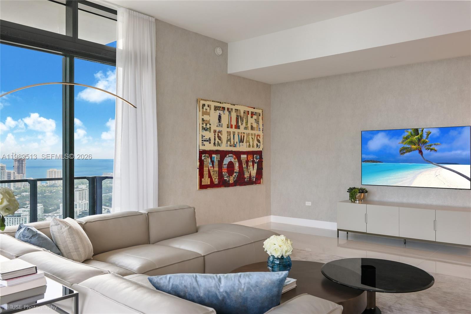 88 Southwest 7th Street, Unit 4101 Miami, FL 33130 - Photo 10 of 35 a living room with furniture and a large window