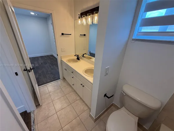 a view of room with wooden floor