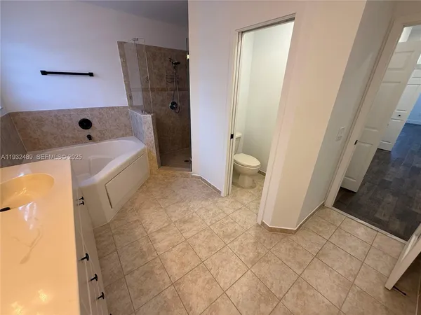 a bathroom with a toilet and a sink