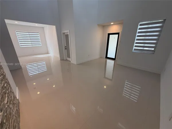 a view of kitchen and entryway with furniture