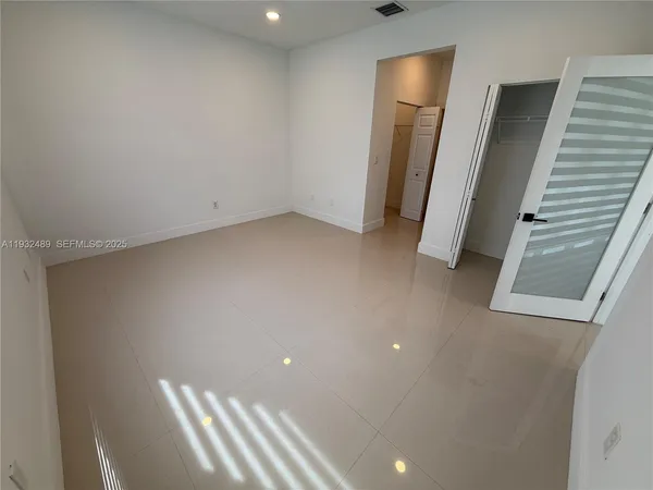 a view of room with window and stairs