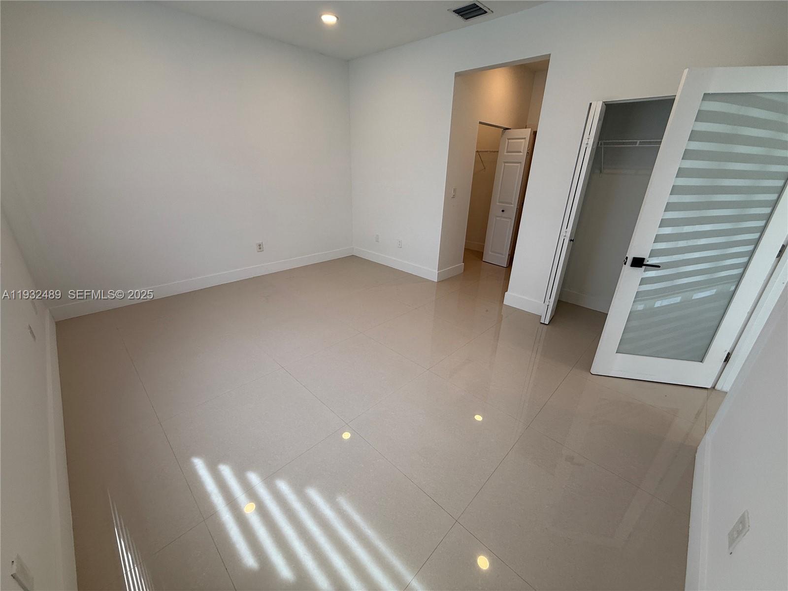 107 Southeast 22nd Terrace Homestead, FL 33033 - Photo 9 of 24 a view of room with window and stairs