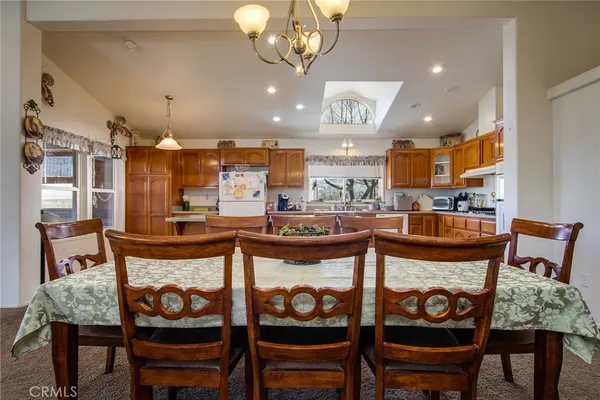 a kitchen with refrigerator sink and cabinets
